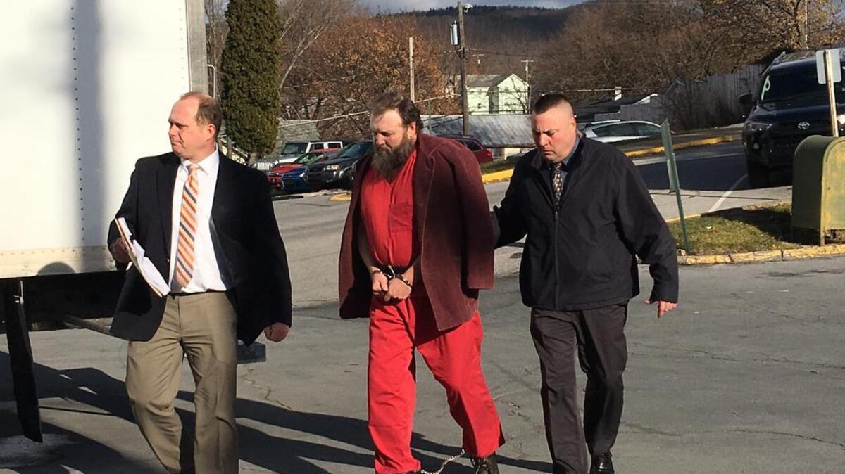Franklin Furl III is led to court Wednesday morning in Bellefonte for a preliminary hearing on the reported Snow Shoe police shootout.