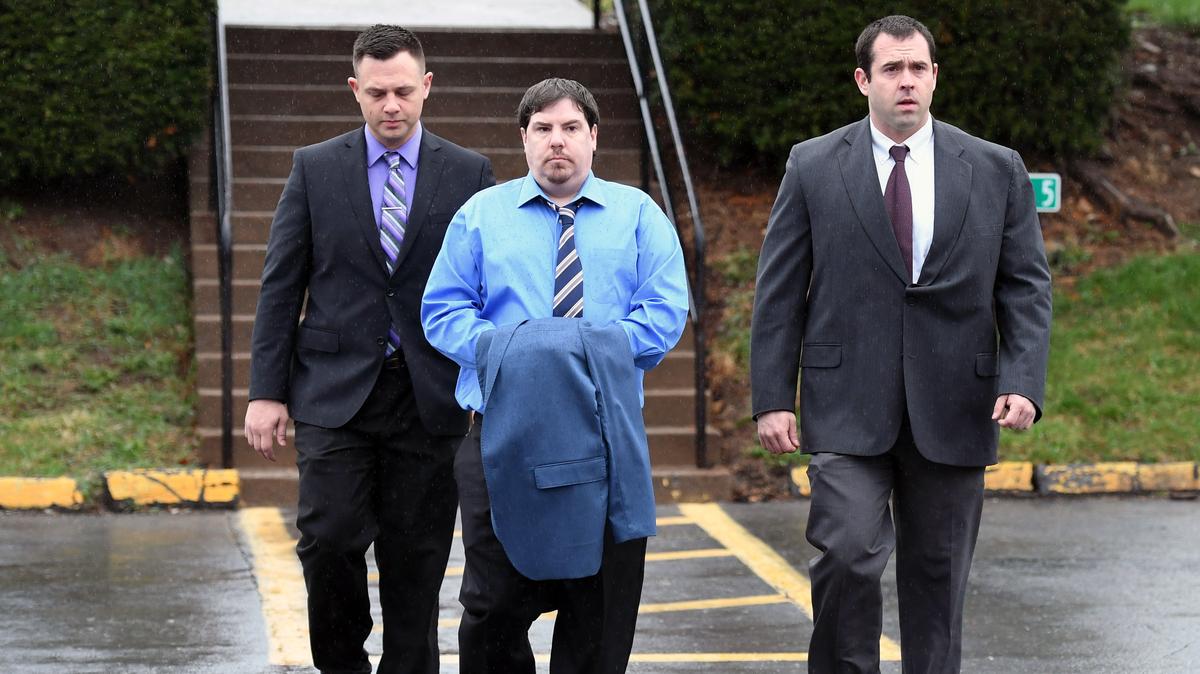 George Ishler walks toward the courthouse for the murder trial for Ronald Bettig Monday, April 16, 2018 at the Centre County Courthouse.