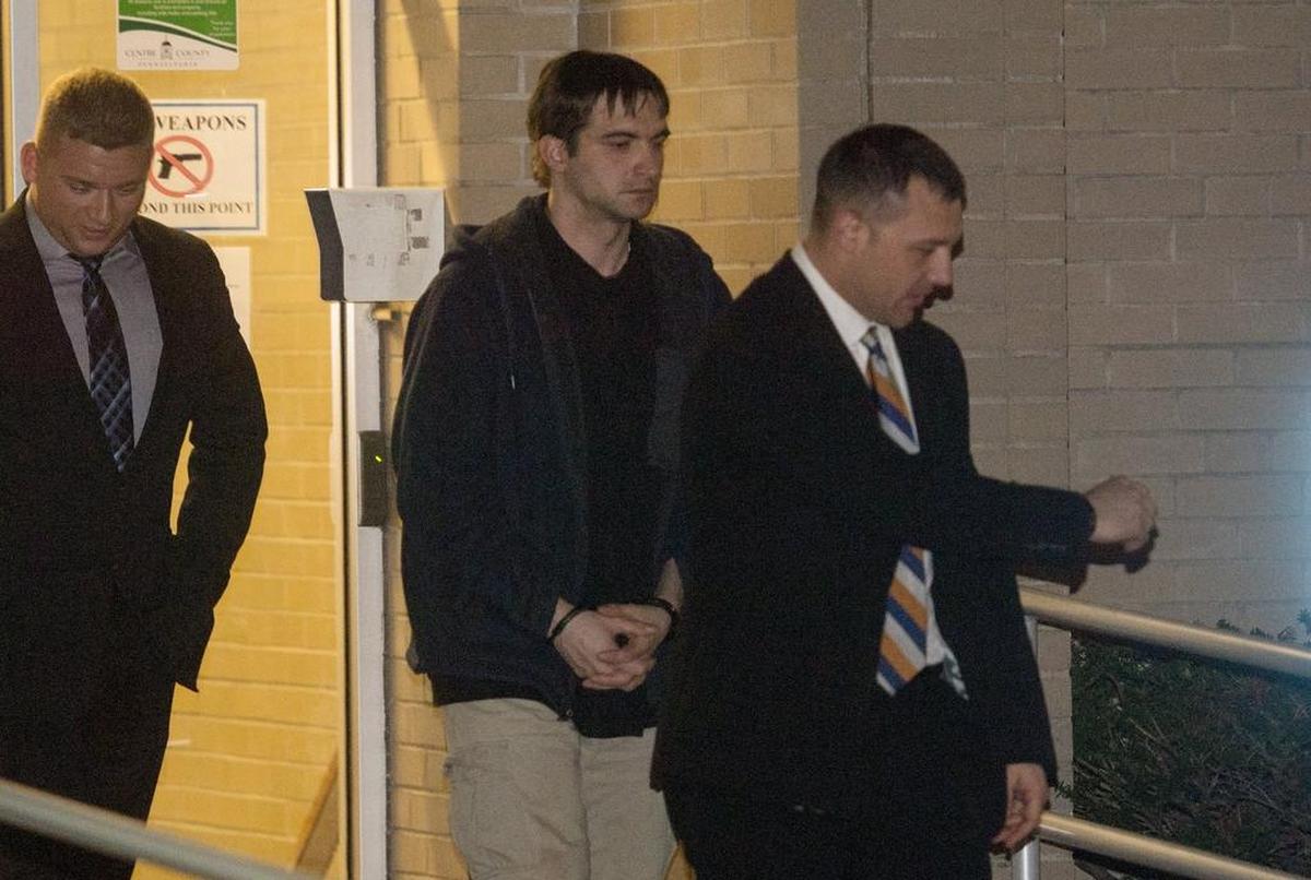Joseph Neff tries to avoid the media as he leaves the the Centre County Courthouse on November 30, 2017.