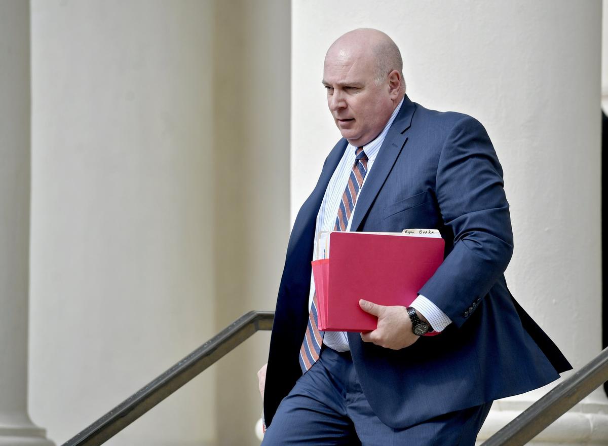 State College police detective David Scicchitano leaves the Centre County courthouse on May 3, 2018.