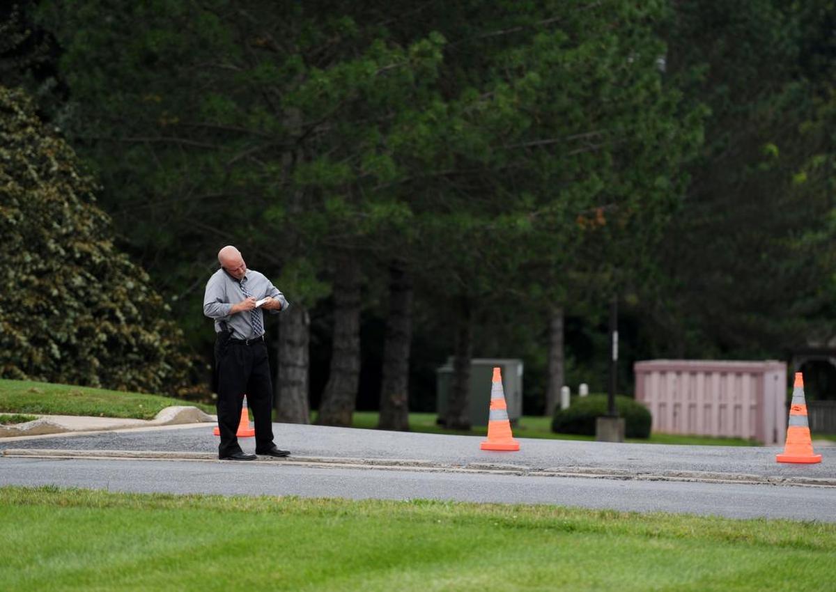 Ferguson Township police Chief Chris Albright talks on the phone after a robbery occurred late Tuesday afternoon Tuesday at the SPE Federal Credit Union off Science Park Road.