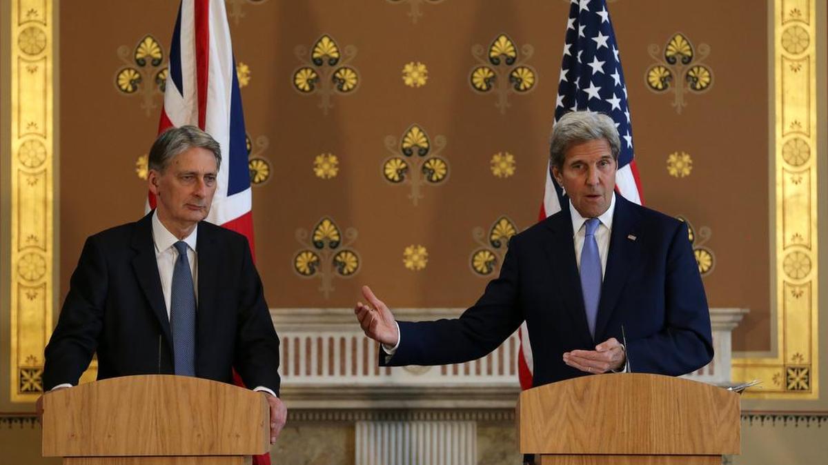 U.S. Secretary of State John Kerry, right, holds a joint press conference with British Foreign Secretary Philip Hammond after their meeting at the Foreign and Commonwealth Office in London on Monday. Kerry says the negotiations for Britain to leave the European Union must not “cut the nose off to spite the face.” He believes Britain and the EU can protect shared values and remain strong U.S. partners.