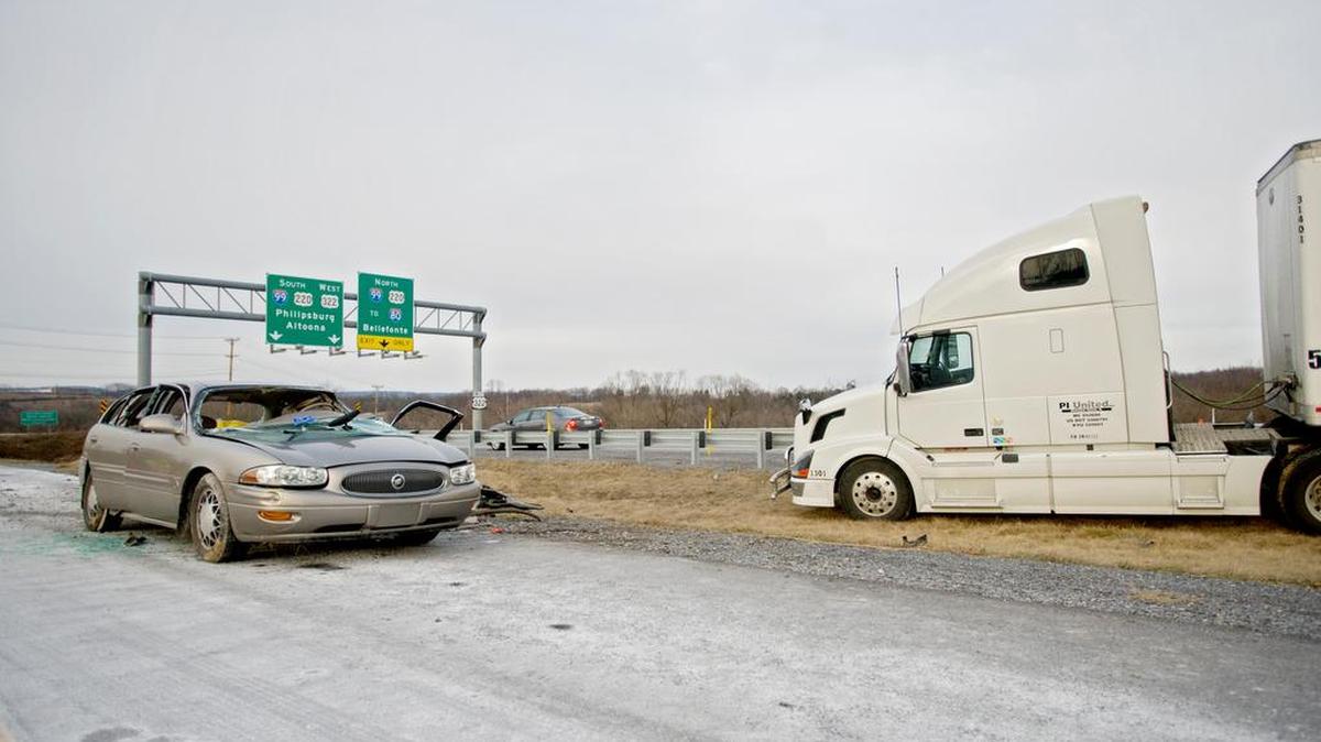 An automobile and a tractor trailer truck accident on Route 322 between Park Avenue and College Avenue on Wednesday, January 20, 2016. A helicopter landed on the road to take the male driver of the vehicle from the scene after Alpha Fire Company helped to extract him. A female passenger was transported by ambulance, and the driver of the tractor trailer truck by police cruiser to Mt. Nittany.