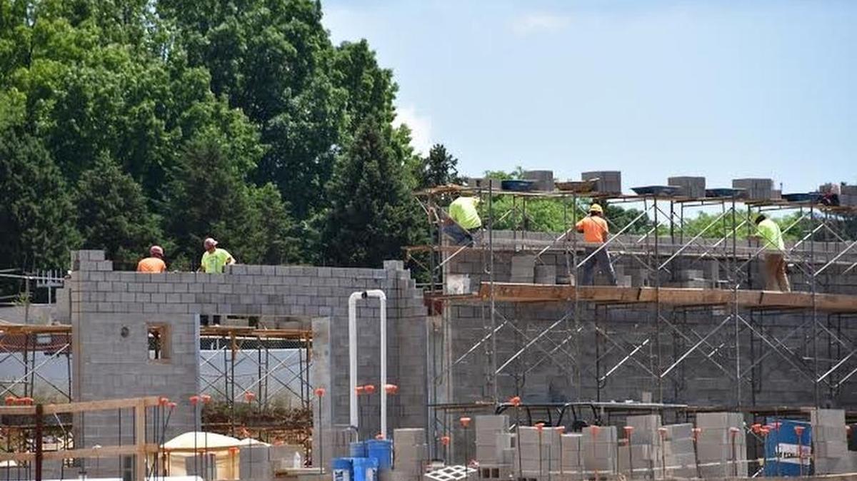 Construction crews work at State College Area High School. Construction will continue through the summer. Crews said they’ll make a noticeable dent in the work by the time school starts.