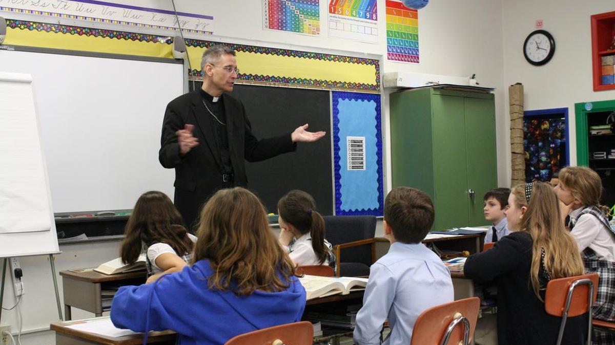 Bishop Mark Bartchak visits St. John in November to celebrate an anniversary Mass at the school.