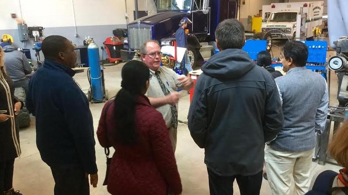 Central Pennsylvania Institute of Science and Technology Vice President of Postsecondary Education Todd Taylor gives fellows from the Penn State College of Education Hubert H. Humphrey Fellowship program a tour of the career technical school.