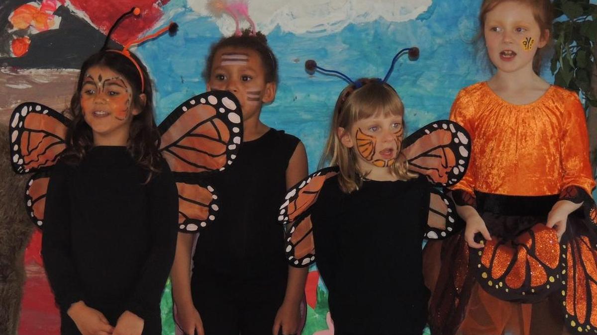State College Friends students dress as butterflies for a performance at the school.