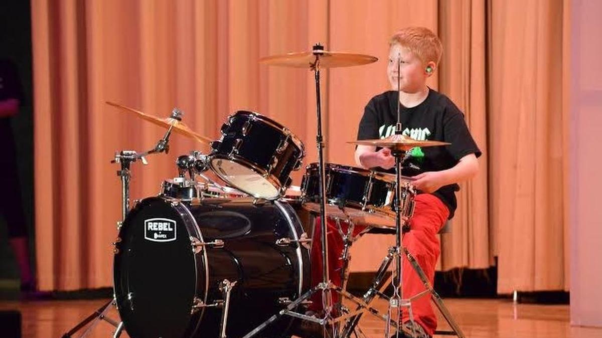 Third-grade student Evan Hoffman played the song “Dynamite” on the drums Friday at the 22nd annual Lip-Sync Benefit Show at the Bellefonte Area High School auditorium.