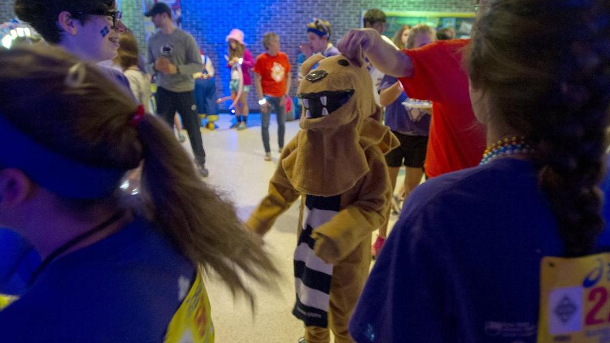 Third-grader Jacob Will entertains the dancers while dressed as the Penn State Nittany Lion during the 2015 State College Mini Thon. Middle school students held an ice cream social fundraiser Saturday to benefit the 2017 Mini-Thon.