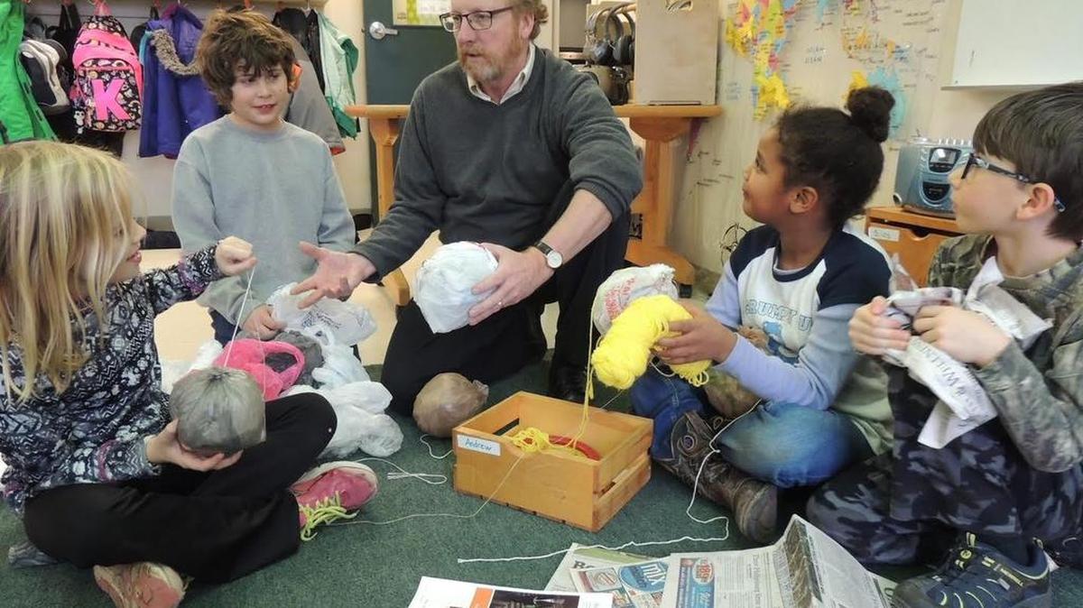 Students in State College Friends School teacher Renée Kredell’s classroom explain their fundraising idea to Head of School Dan Hendey. Students will make and sell homemade rag balls to bring awareness to others about the needs of children in Africa and to earn money to send them self-inflating soccer balls. Pictured from left: Esmée Sherrill, Andrew Fetterolf, Dan Hendey, Khadijah Kitchens and Silas Dudash.