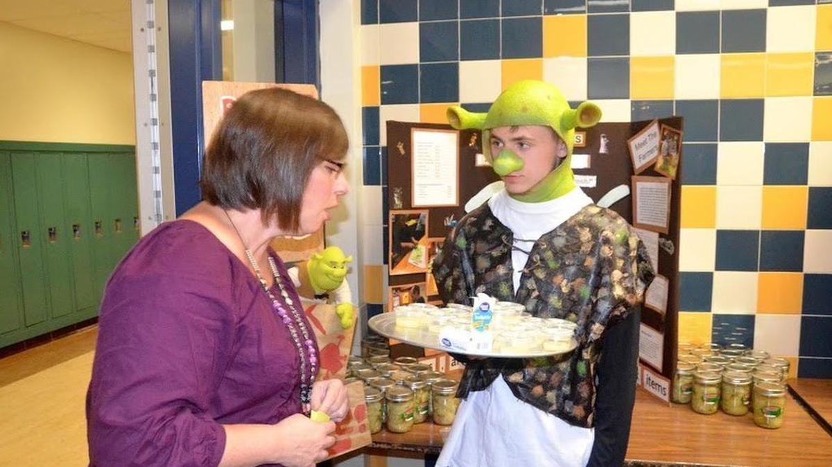BEA student Toby “Cha Cha” Chencharick serves locally grown and student-made food samples during the Fresh is Better Showcase on Friday at the high school. The event was a way to promote locally grown food, while also collecting donations for local food banks.