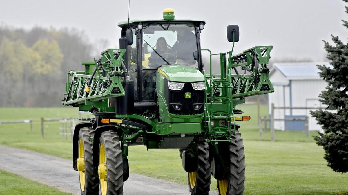Penns Valley junior Payton Ilgen test rides in a John Deere sprayer during “Plant Yourself in Agriculture” at the Russell E. Larson Agricultural Research Center on Wednesday.