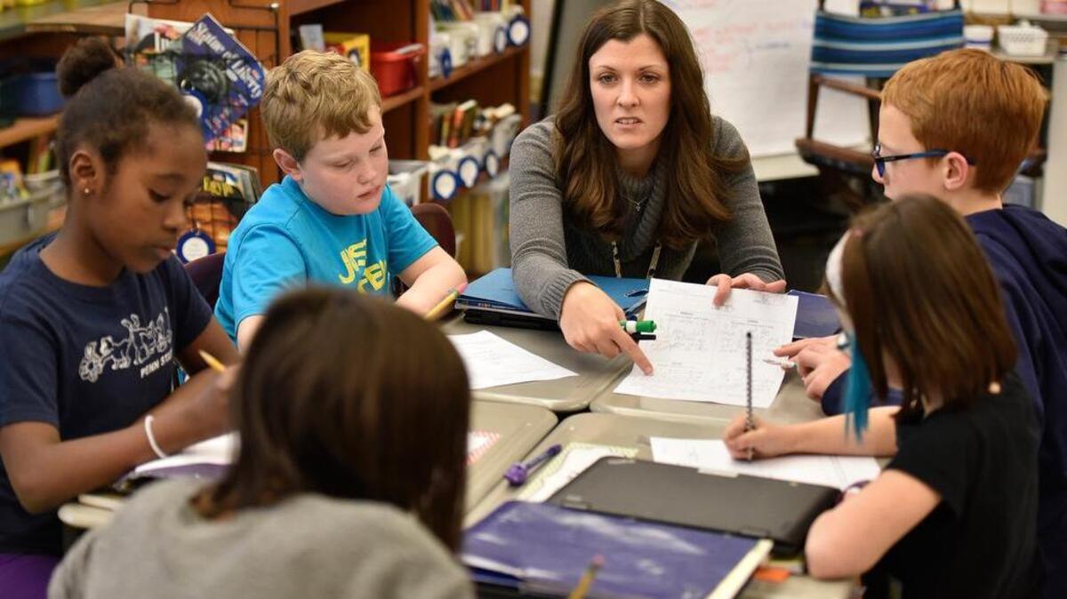 Michele White teaches math in her fourth-grade classroom at Park Forest Elementary School on Dec. 12.