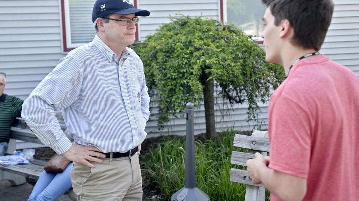 Incumbent Jim Leous, who was re-elected to the State College Area school board, chats outside of the Harris Township precinct at the Zion Lutheran Church on Tuesday.