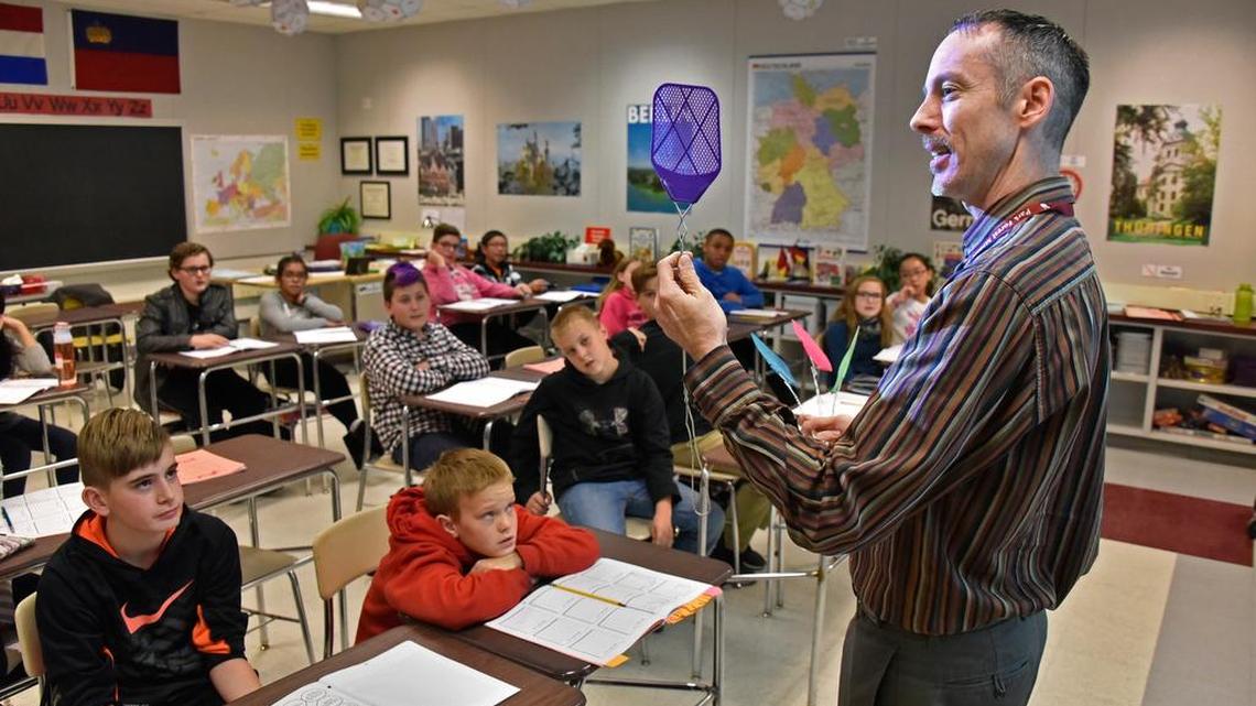 David Strock uses a fly swatter to identify color during sixth grade exploratory German class.