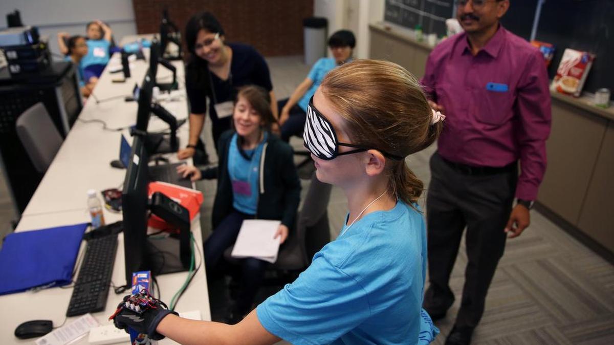 Ava Langelaan, 12, tests a computer-based hand prototype used to help the visually impaired during Penn State’s inaugural Computer Science Camp for Girls on Tuesday at the Westgate Building on campus.