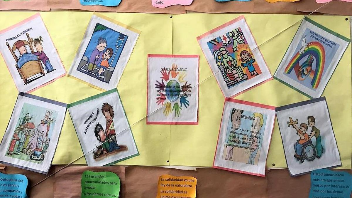 A bulletin board promoting solidarity as a core component of their law and health is pictured.