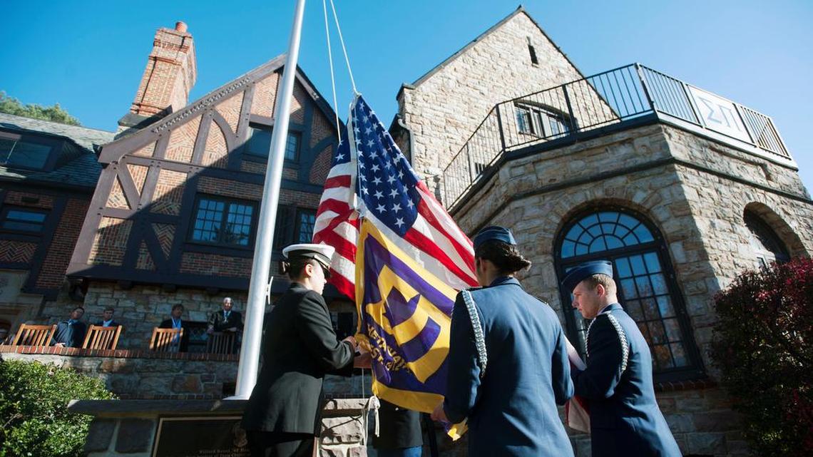 Penn State ROTC Joint Service Color Guard members raise the flag during the Wilford Beisel Memorial Flagpole Dedication Saturday at Sigma Pi fraternity.