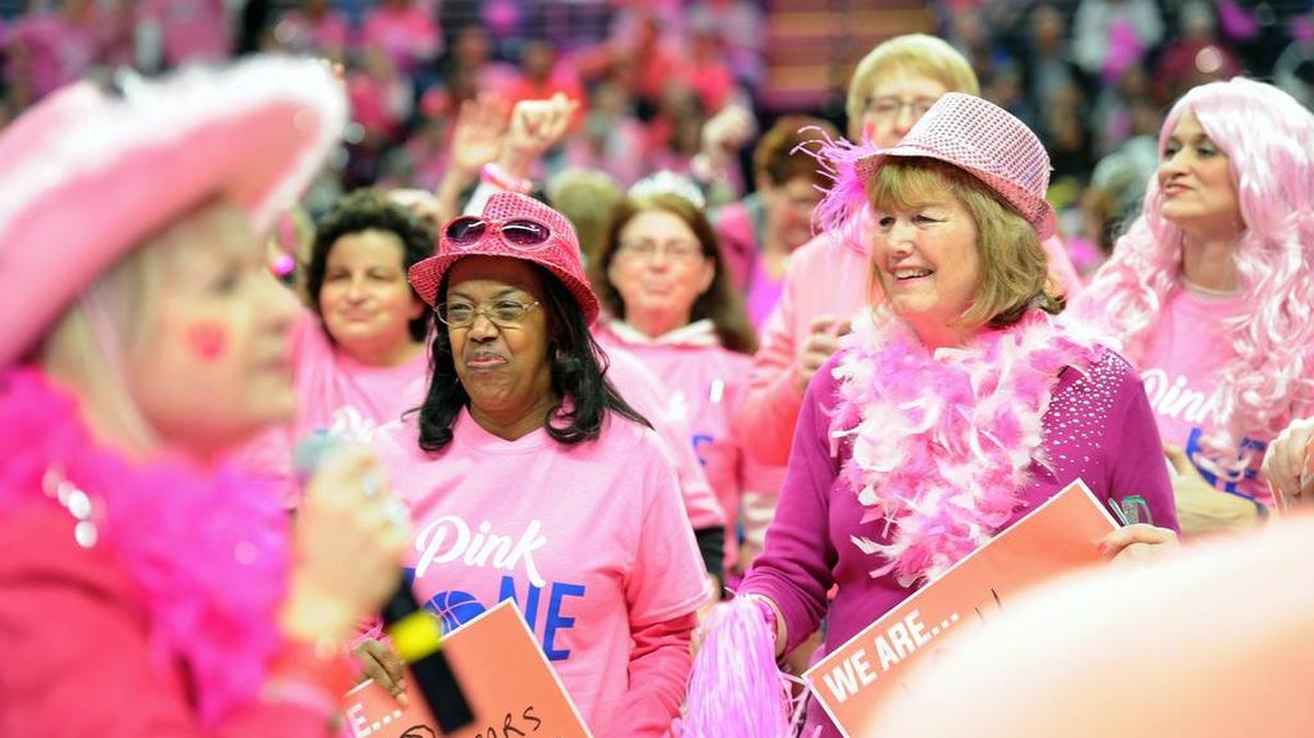 Survivors smile during the Pink Zone celebration in February 2018 at the Bryce Jordan Center. A virtual pregame show will take place this year, in lieu of survivors and fans at the game.