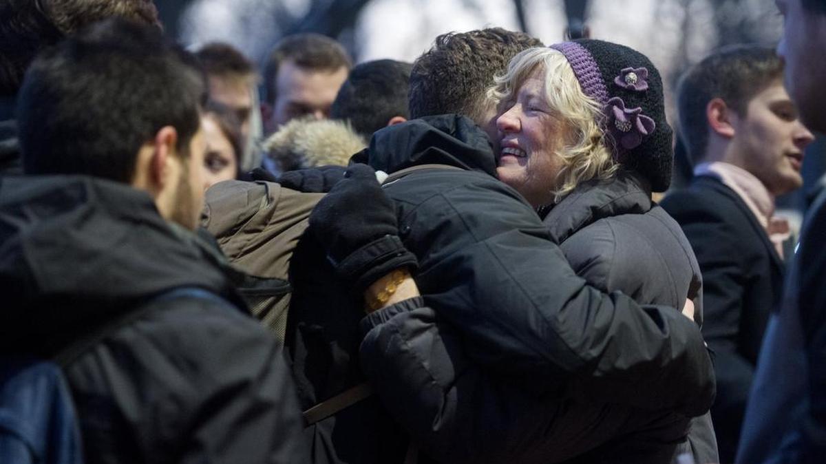 Tali Denton gets hugs from her son’s fraternity brothers after a vigil Alpha Tau Omega organized to remember Will Denton on Thursday, January 18, 2018.