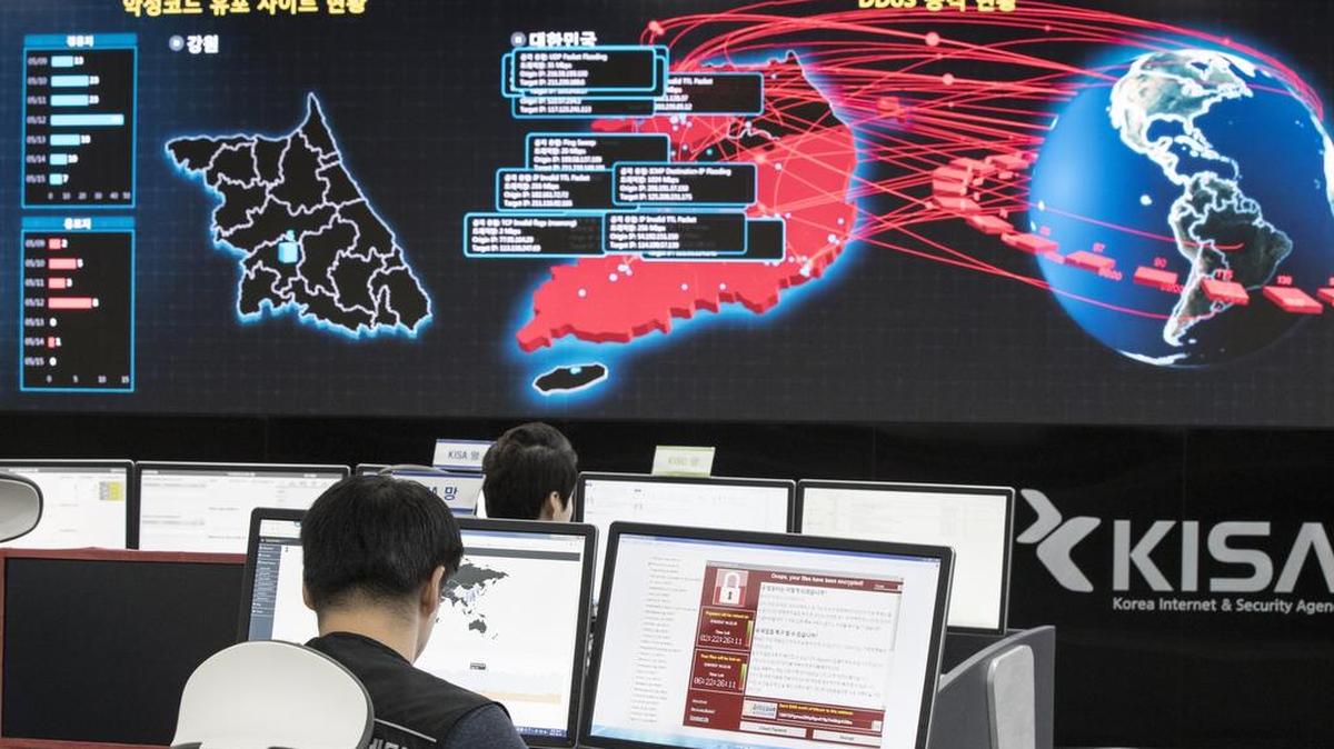 Employees watch electronic boards to monitor possible ransomware cyberattacks at the Korea Internet and Security Agency in Seoul, South Korea on May 15.