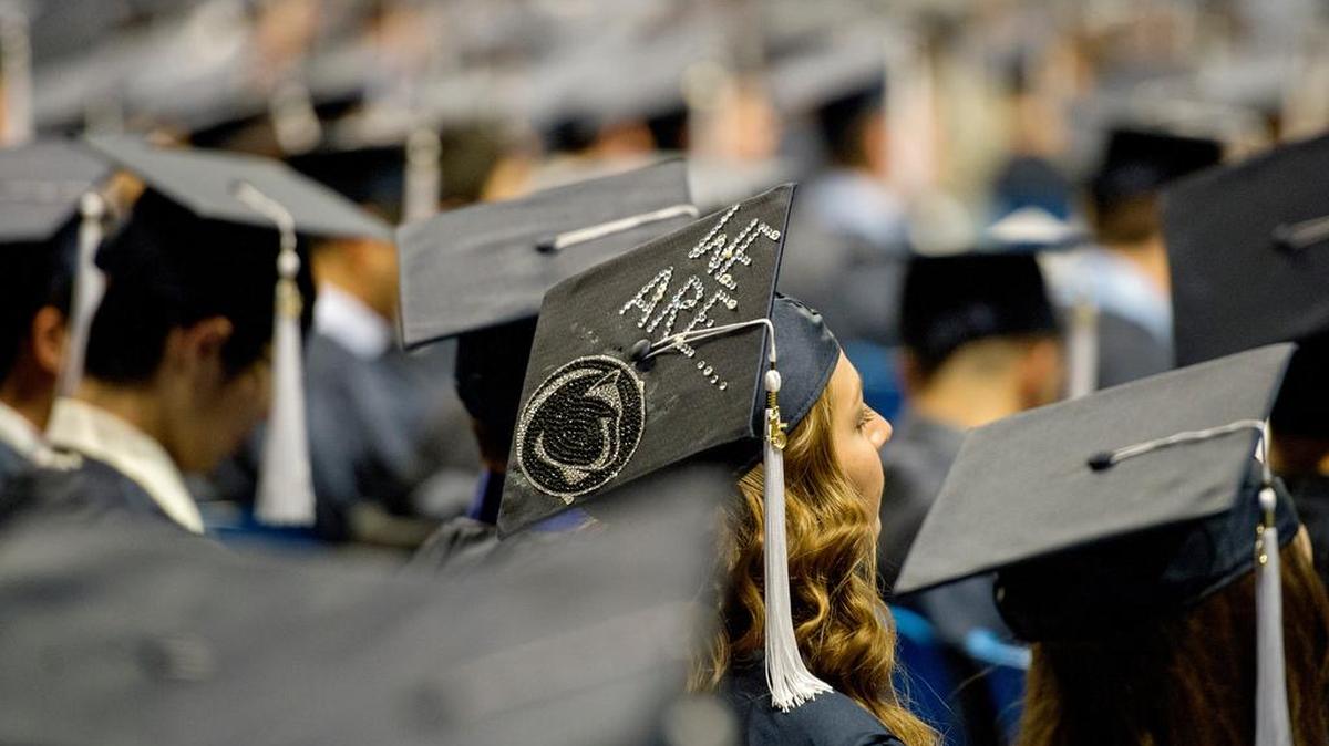 Students eagerly wait to become alumni during Penn State fall 2015 commencement on Saturday at the Bryce Jordan Center.