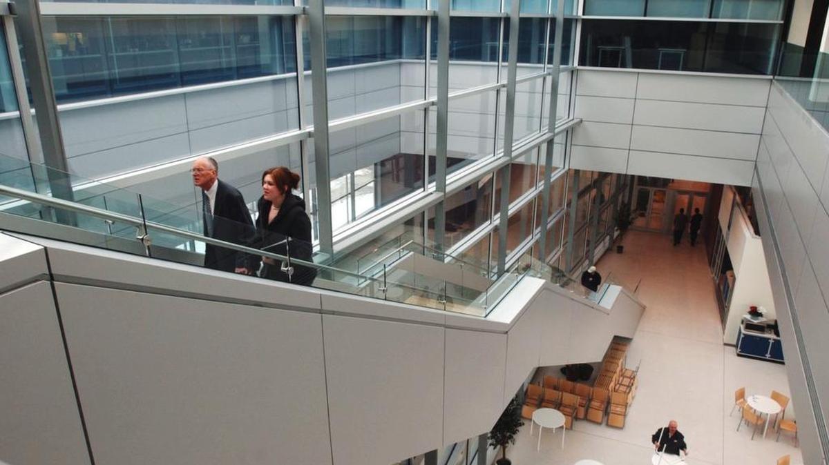 People walk up the main stair case in Penn State’s IST Building. Andrew Sears, dean of the College of Information Sciences and Technology, said responsibility for cybersecurity has to be shared accross departments.