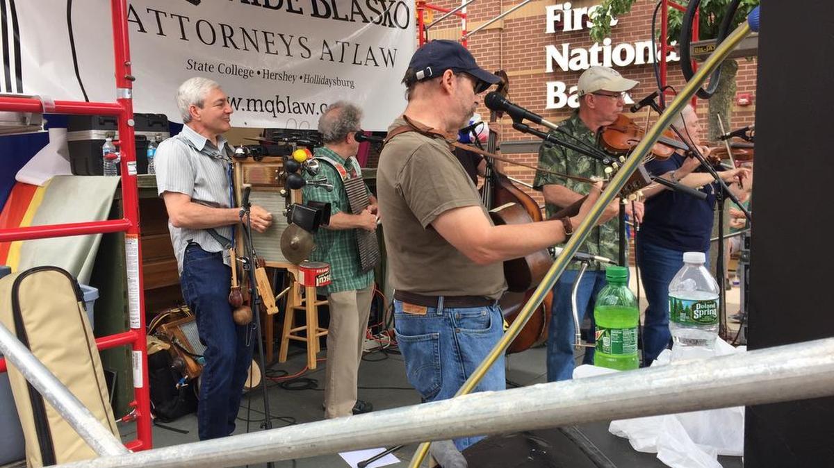 Former Penn State president Graham Spanier was onstage with the Rustical Quality String Band at the Central Pennsylvania Festival of the Arts on Saturday. Spanier is free pending appeal of his misdemeanor child endangerment conviction.