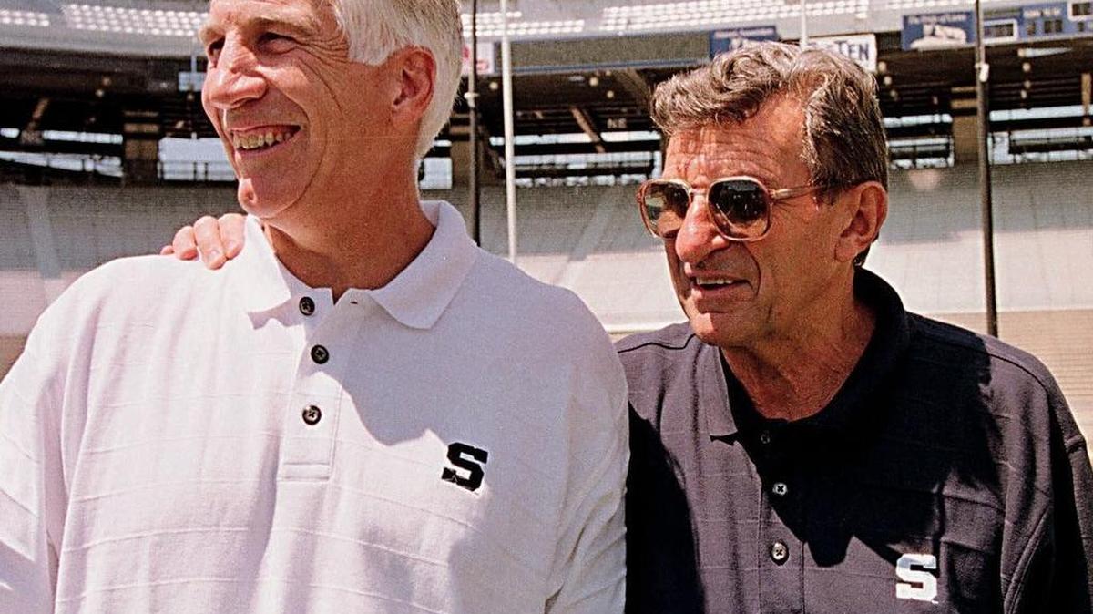 Penn State head football coach Joe Paterno, right, poses with his defensive coordinator Jerry Sandusky during Penn State Media Day at State College, Pa. Friday, Aug. 6, 1999.