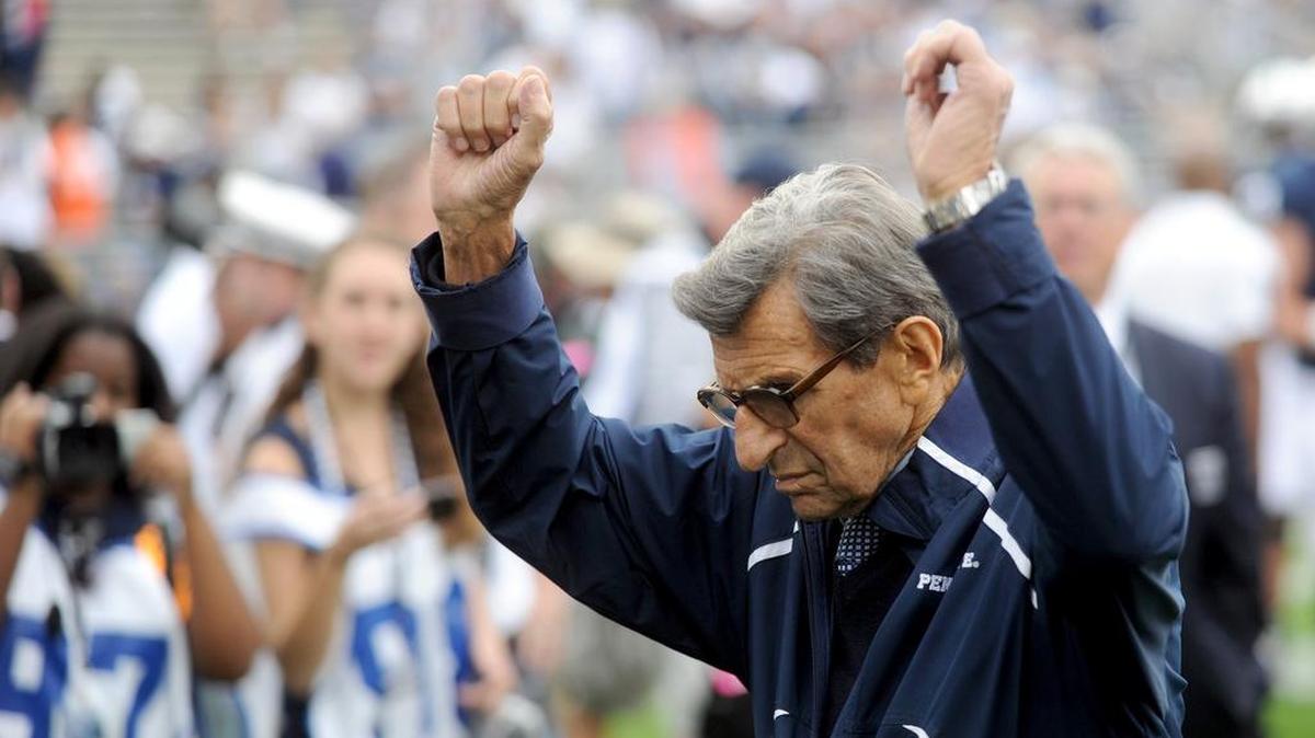 Joe Paterno signals to the crowd before Penn State’s game against Eastern Michigan on Saturday, Sept. 24, 2011.