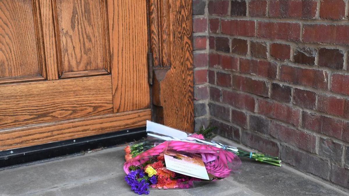 Flowers were placed outside the former Beta Theta Pi fraternity house in memory of Timothy Piazza on the one-year anniversary of his death on Sunday.