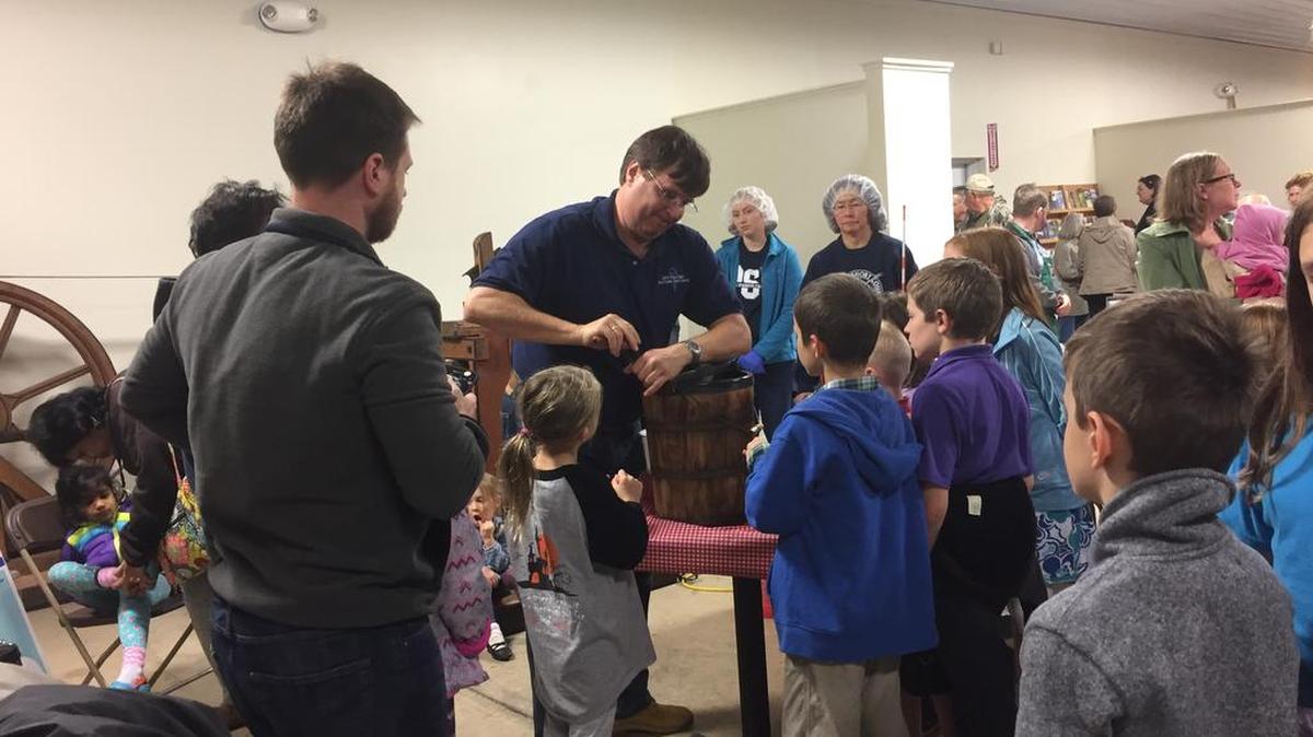 Children and families gather around Bob Roberts, professor and head of food science at Penn State, for an ice cream-making demonstration during the “Hey! There’s Science in My Ice Cream!” event at the Pasto Agricultural Museum in Pennsylvania Furnace on Sunday.