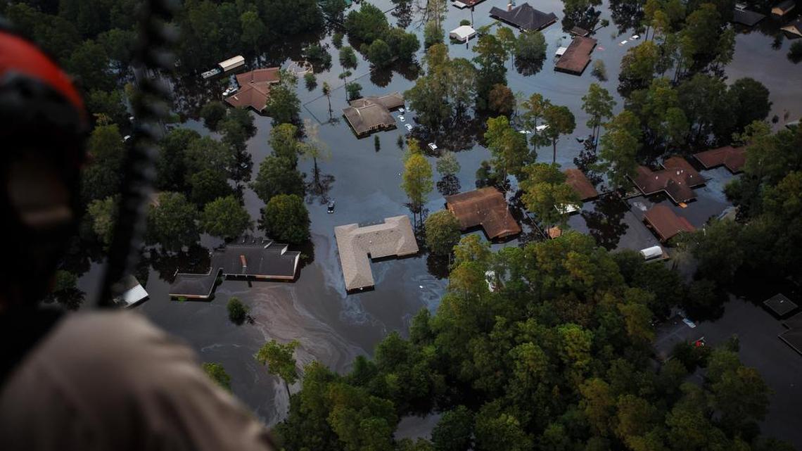 Rising floodwater engulfs entire residential neighborhoods in the aftermath of Tropical Storm Harvey near Lumberton, Texas, on Thursday.