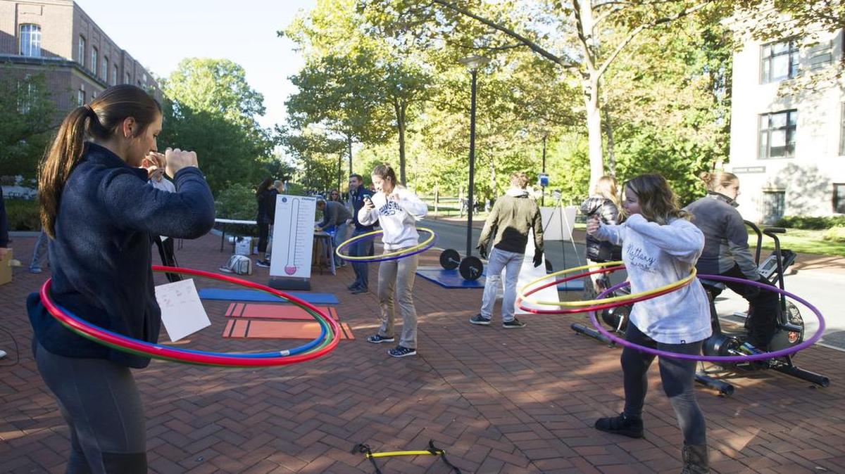 From left, Penn State freshman Emily Salter, senior Emily Vanya and senior Lauren Muszyinski Hula-Hoop at the Willard Building exercise station on Monday during Penn State EIM Week.