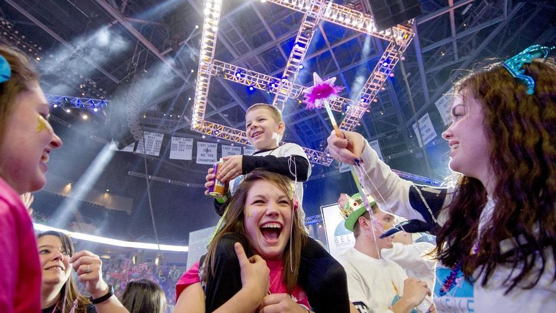 Isaac Kreider, 6, shoots silly string from the shoulders of Amber Jones during the Penn State IFC/Panhellenic Dance Marathon in 2016.