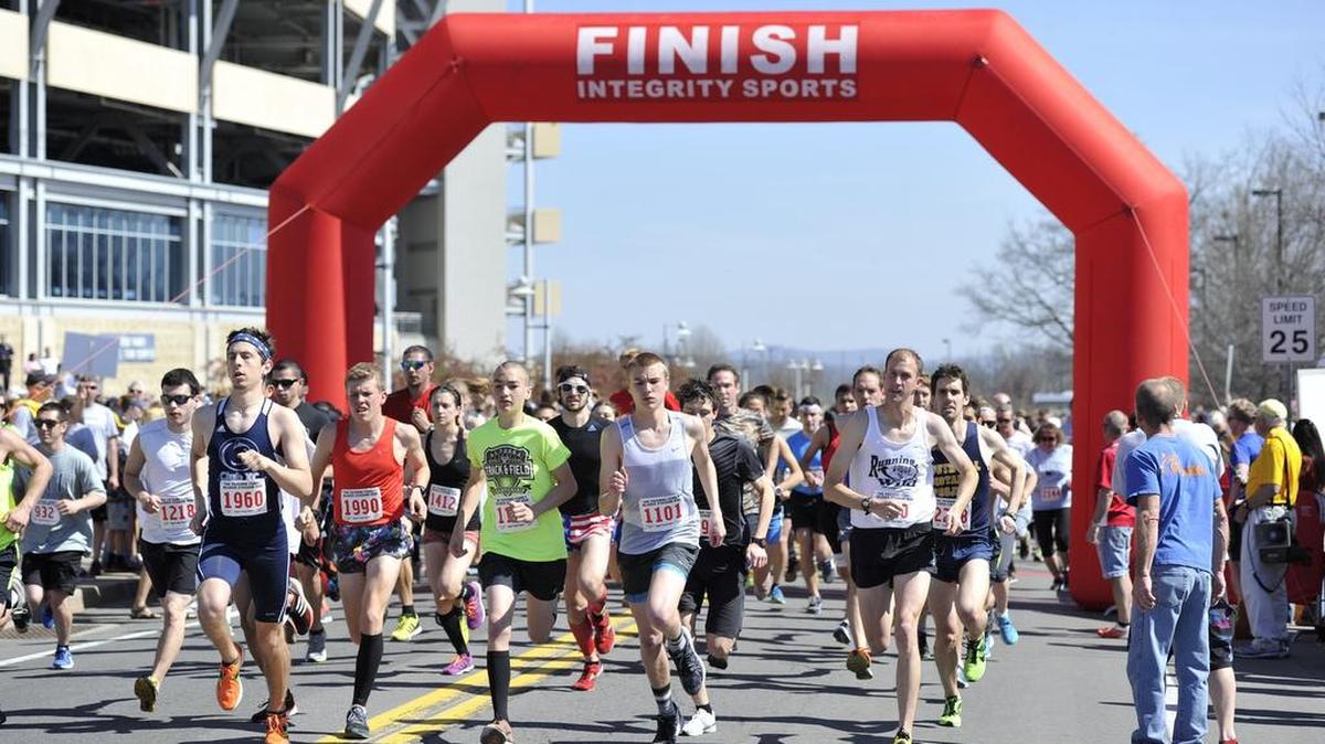 Runners take off on Curtin Road in 2016 during the Paterno Family Beaver Stadium Run.