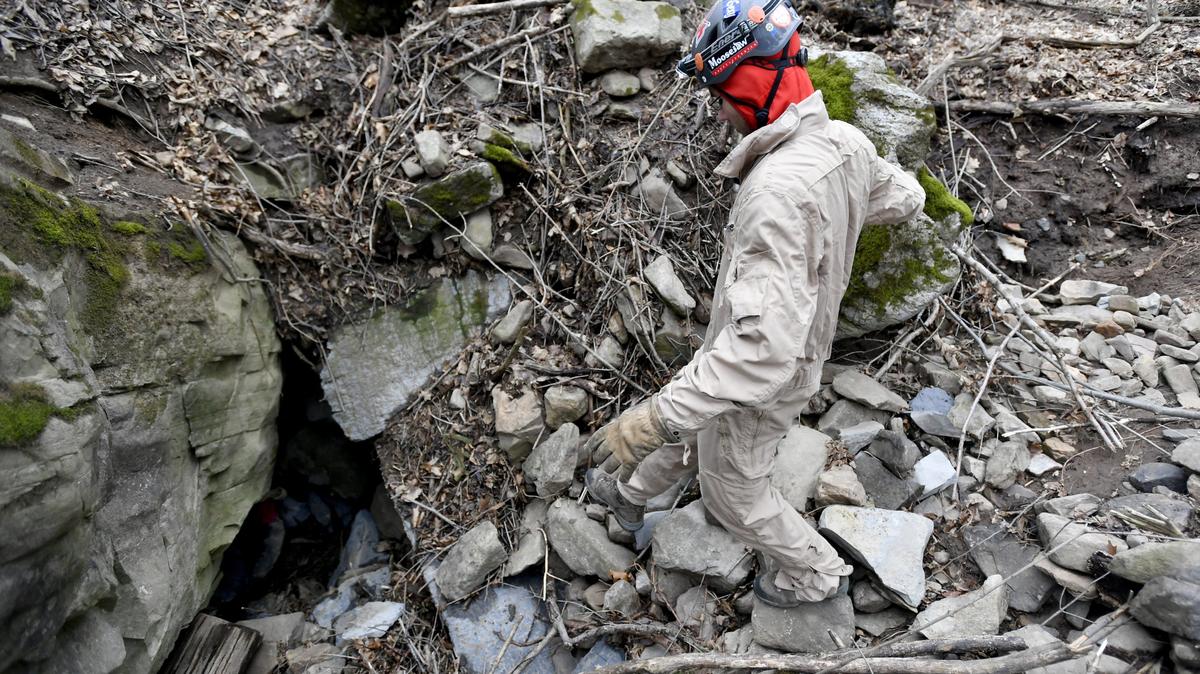 Jacob Cramer walks toward the entrance of the Kepler Cave near Pine Grove Mills to join fellow members of the Nittany Grotto Caving Club on Thursday, April 19, 2018.