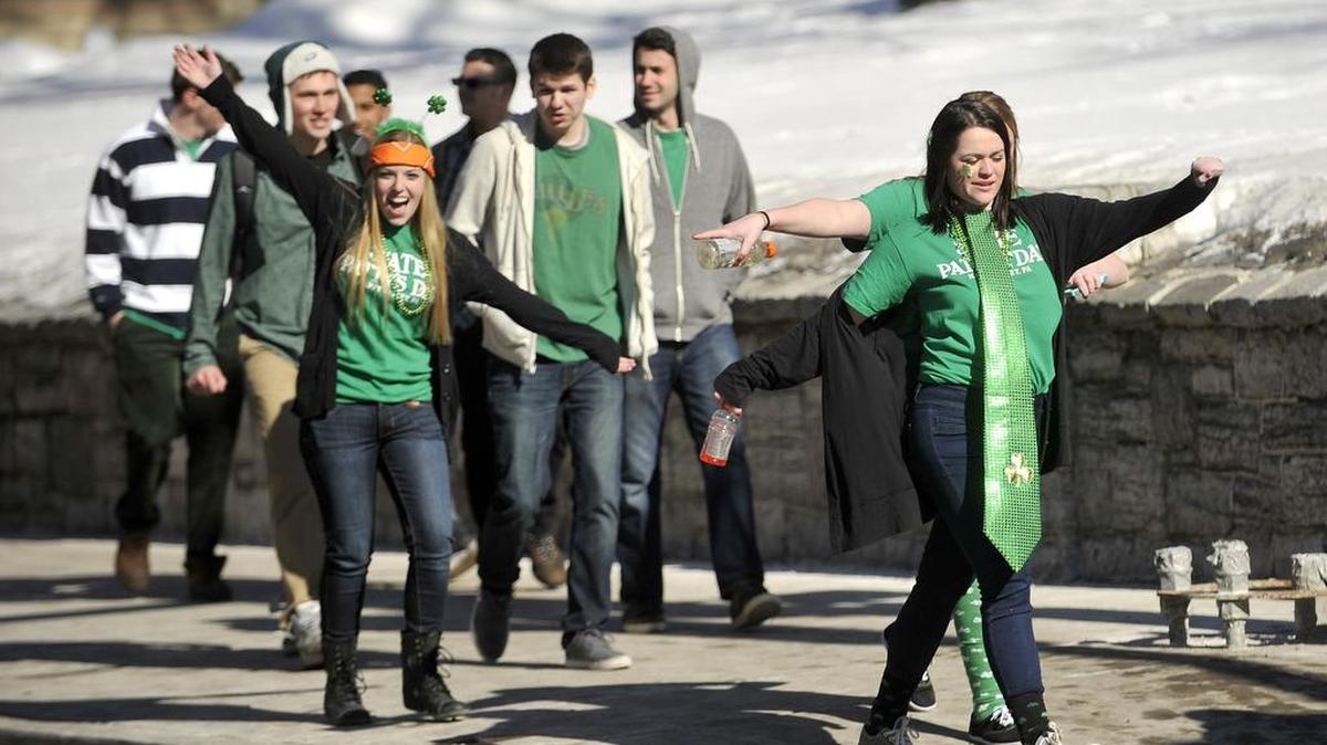 Pedestrians walk along Beaver Avenue wearing State Patty’s Day shirts during last year’s event.