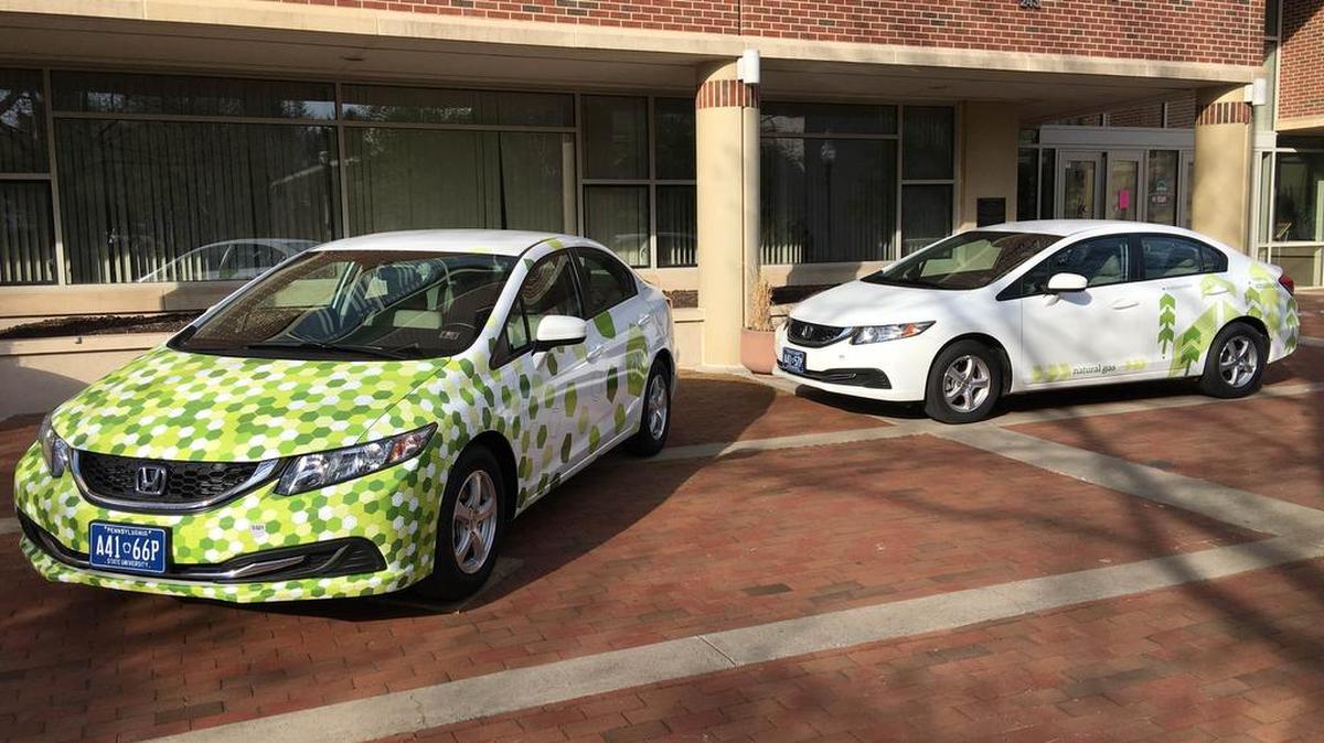 The first project attendees encountered sat outside the front doors of the borough building, as three Priuses from the Penn State Transportation Department were wrapped in green designs and lettering highlighting their compressed natural gas fuel systems.