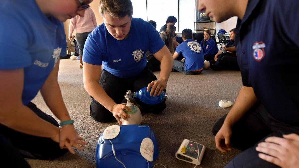 High School students participate in an emergency services class at Central Pennsylvania Institute of Science and Technology on Friday, January 6, 2017. Matthew Caldana gives two breaths of air as Makayla Dreibelbis prepares to start more chest compressions and James Ard watches the AED.