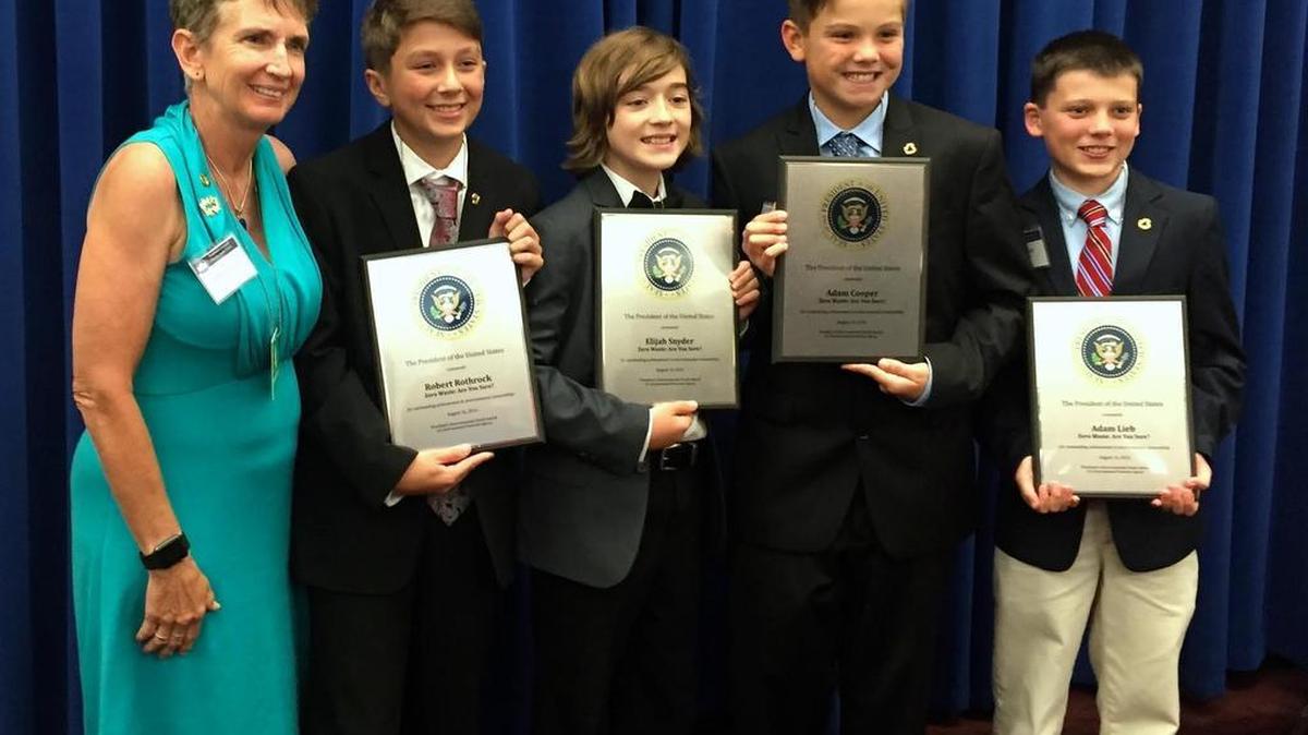 Park Forest Elementary School Principal Donnan Stoicovy poses with students Adam Cooper, Adam Lieb, Robert Rothrock and Elijah Snyder. They were the recipients of the President’s Environmental Youth Award for recycling efforts at the school.