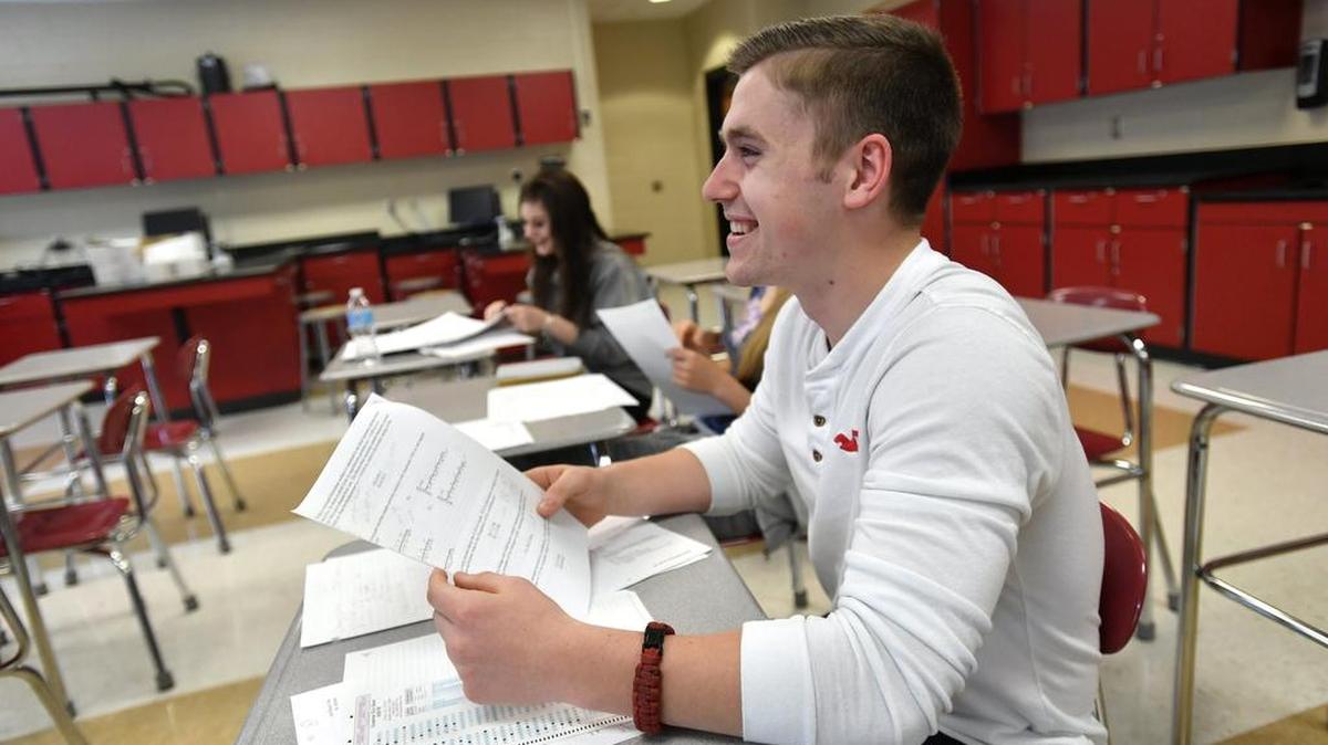Seniors Chauncey Blakeslee, front, and Julia Stone laugh while working in Kevin Harman’s AP Physics and C Mechanics class. Students at Bellefonte Area High School are taking Advanced Placement classes that can count for college credit. Both Blakeslee and Stone have taken 14 AP classes.
