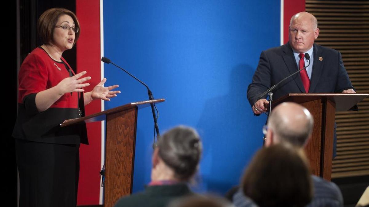 Kerith Strano Taylor, seen at left debating U.S. Rep. Glenn Thompson in 2014, has suspended her congressional campaign after the state Supreme Court’s redistricting decision, electing instead to run for the state House of Representatives.