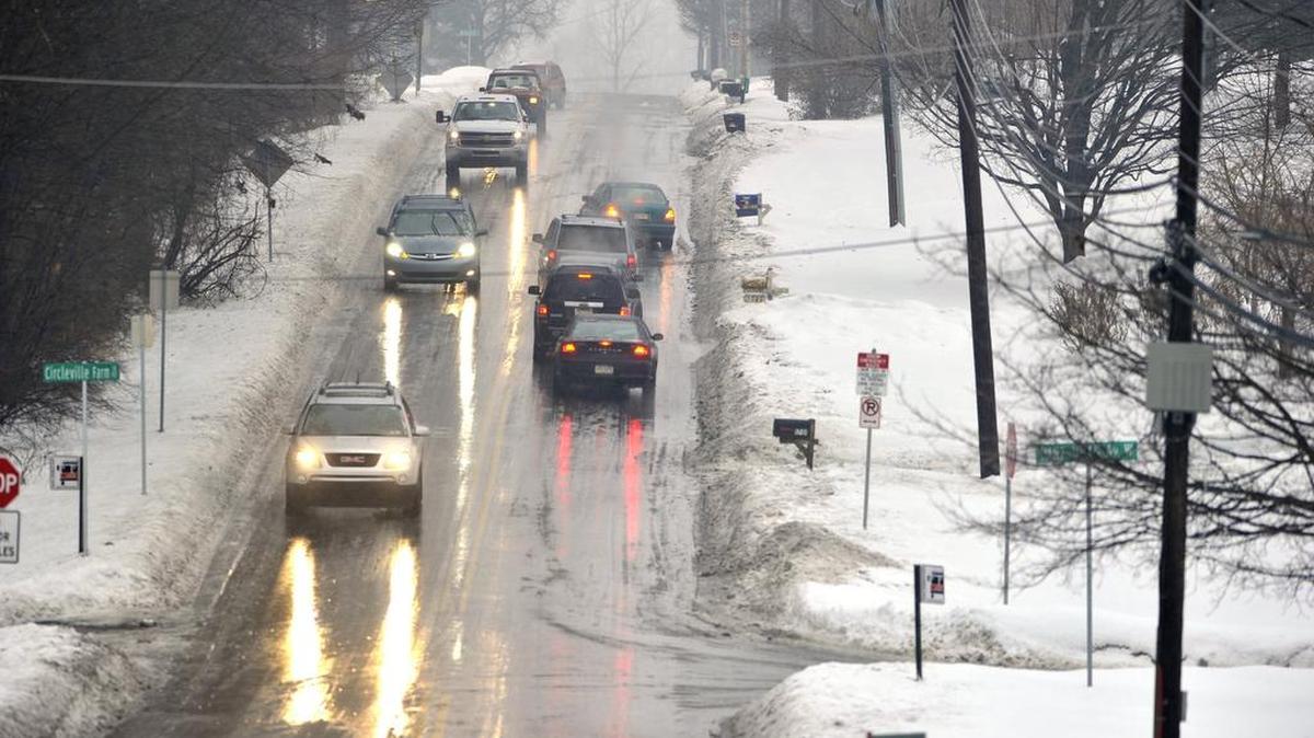 Vehicles couldn't make it up an ice covered Circleville Road, in State College, Pa. when freezing rain hit Centre County, Wednesday, February 19, 2014, causing dangerous travel conditions.