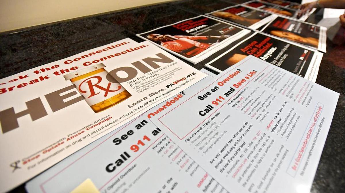 Posters available for everyone who attended the town hall for heroin and opioid crisis in Centre County sponsored by Centre County HOPE Initiative on Tuesday.