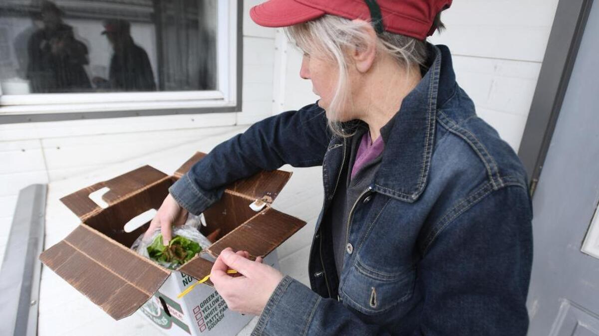 Nell Hanssen of GroundWork Farms CSA and Buying Club talks about the kind of food that comes in the CSA deliveries Tuesday at Spring Bank Acres in Rebersburg.