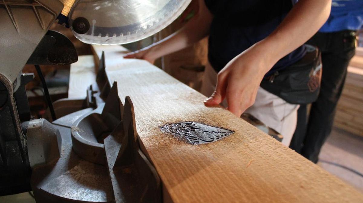 Each piece of lumber made from a 2016 Rockefeller Center Christmas tree carries a commemorative imprint.