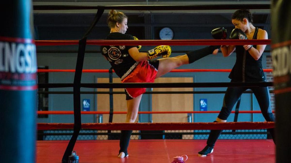 Ashley Rohrback, of Levittown, spars with a Central PA Mixed Martial Arts instructor during women’s only sparring day on Sunday.