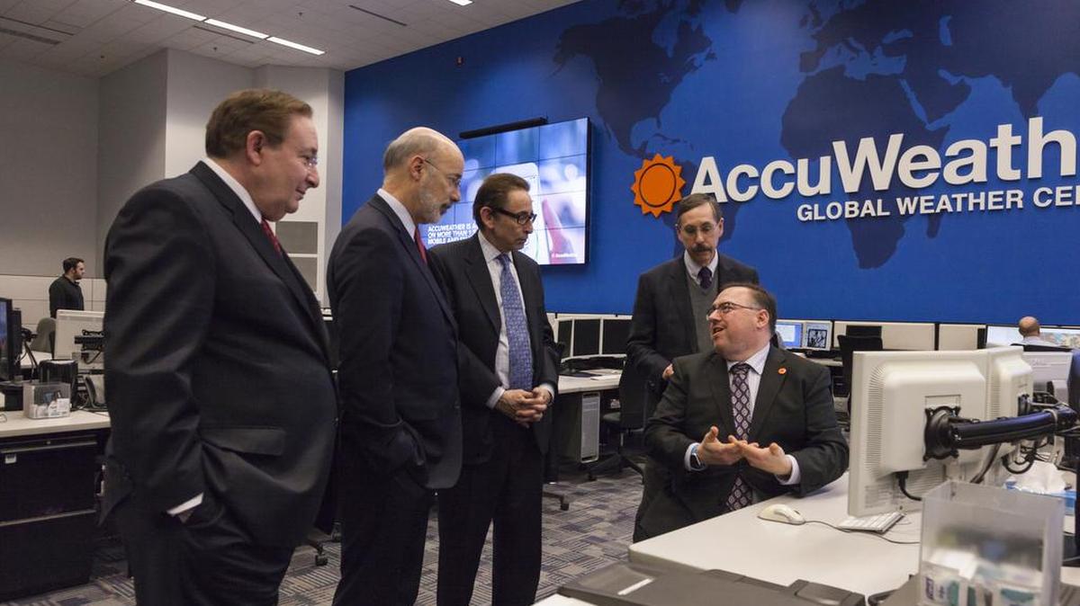 Accuweather CEO and presidential nominee to lead NOAA Barry Myers, left, hosted Gov. Tom Wolf, second from left, on a tour of the State College-based world weather organization, along with AccuWeather founder, president and chairman Joel Myers, COO Evan Myers and Vice President of Forecasting and Graphics Operations Marshall Moss, seated.