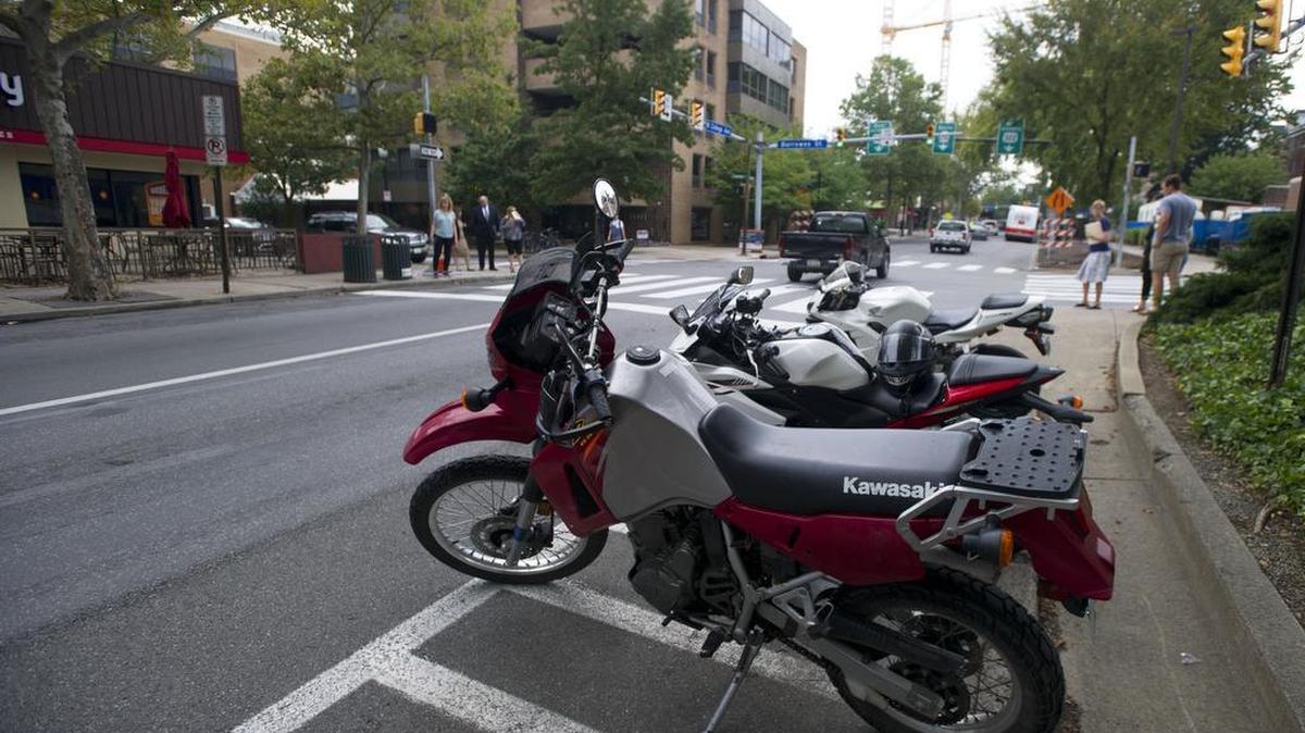 Motorcycles sit parked on the corner of East College Avenue and Burrowes Street Monday, Sept 19, 2016, in State College.
